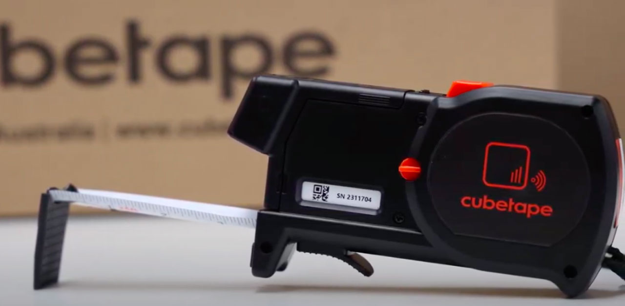 A Tape Measure Displaying The Word Cubetape Prominently On Its Casing