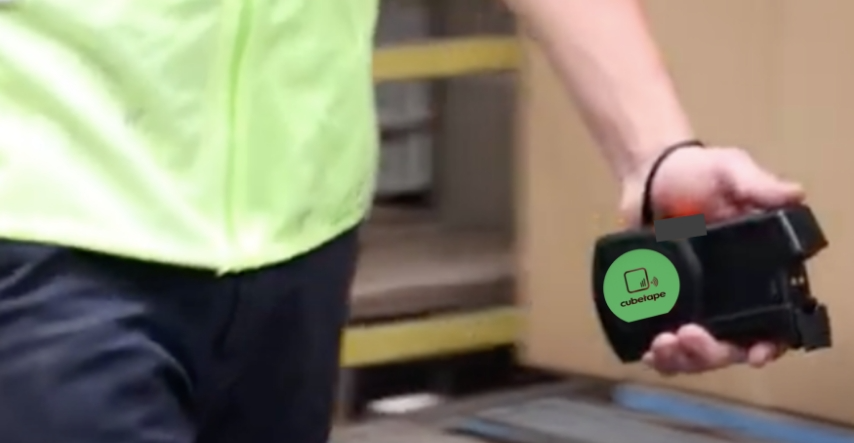 A Person Holds A Small Green Device In Their Hand, Showcasing Its Compact Size And Vibrant Color